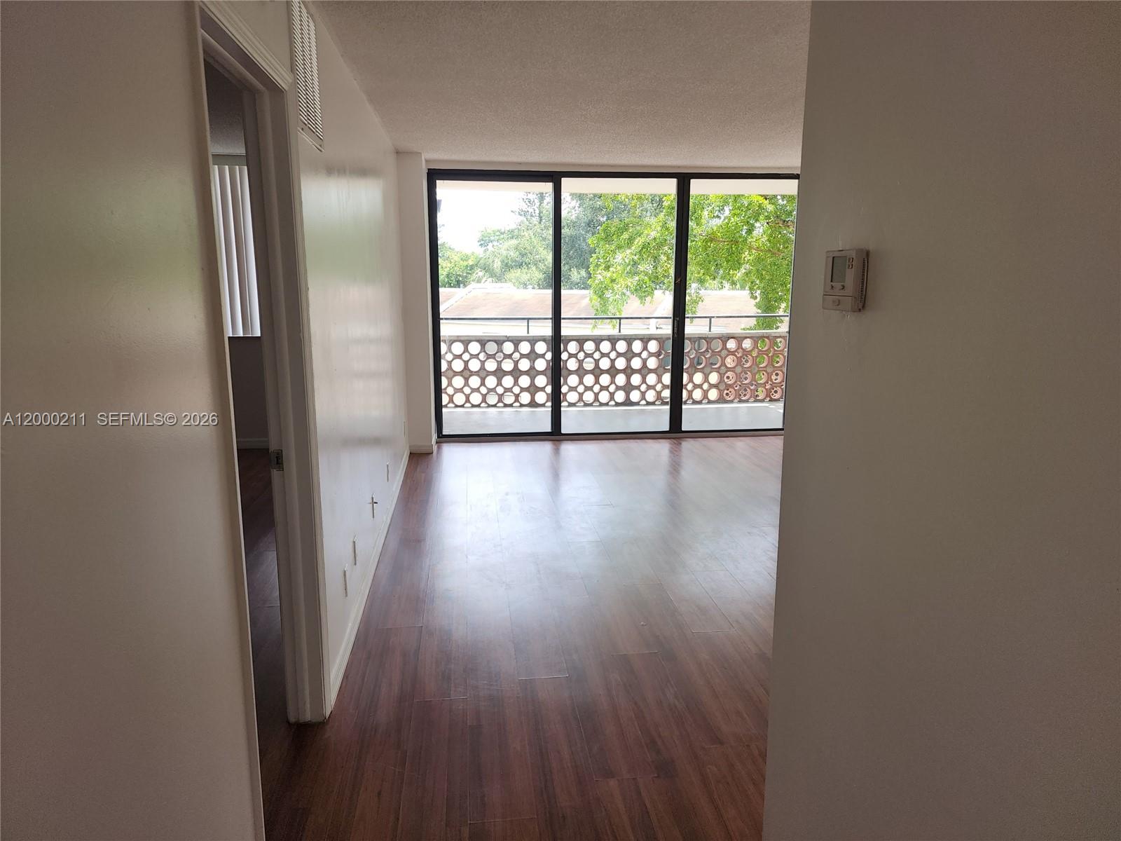 4222 Inverrary Boulevard, Unit 4215 Lauderhill, FL 33319 - Photo 2 of 20 a view of front door with wooden floor