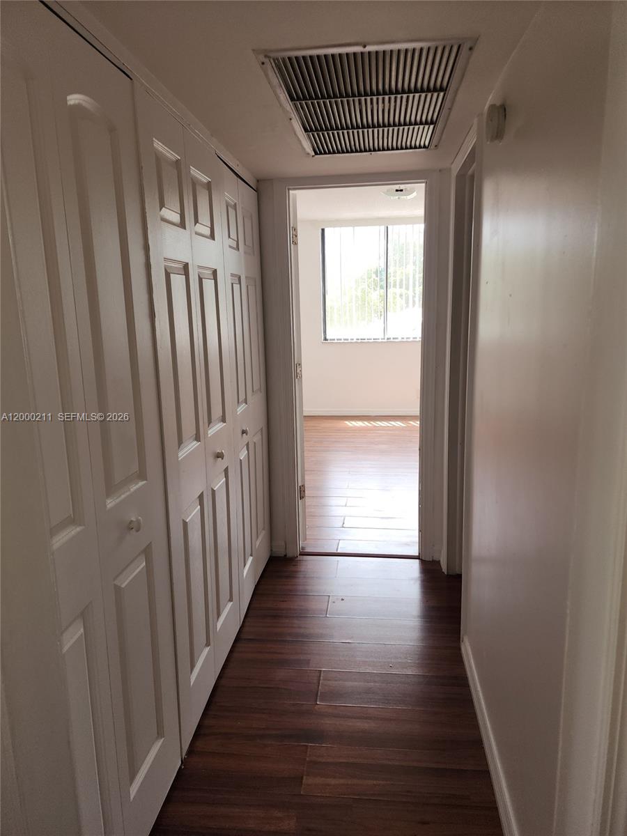 4222 Inverrary Boulevard, Unit 4215 Lauderhill, FL 33319 - Photo 8 of 20 a view of a hallway with wooden floor