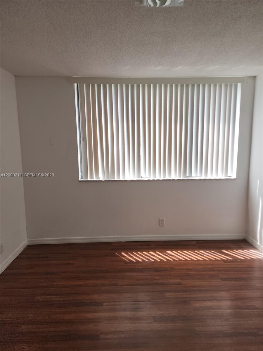 4222 Inverrary Boulevard, Unit 4215 Lauderhill, FL 33319 - Photo 9 of 20 a view of a room that has wooden floor
