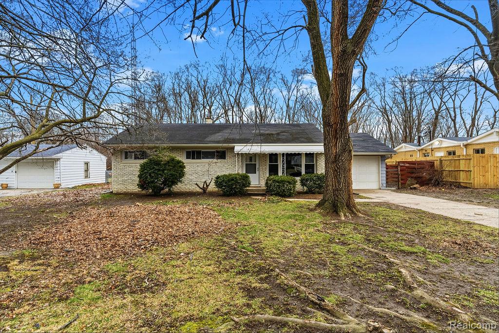 3485 Hammerberg Road Flint, MI 48507 - Photo 2 of 35 Single story home with brick siding, driveway, a porch, a garage, and a chimney