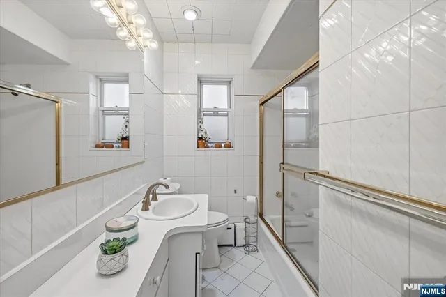 a view of a white house with a yard