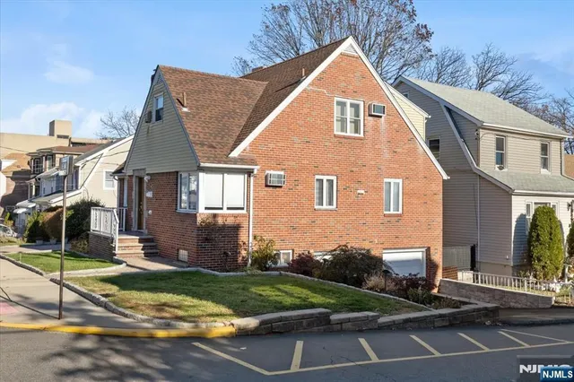 a view of a yard in front of a brick house