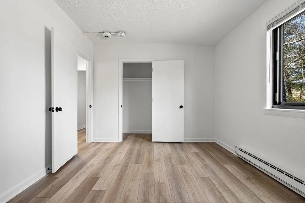 18 Pierce Street, Unit 3B Foxboro, MA 02035 - Photo 12 of 21 a view of a room with wooden floor and window