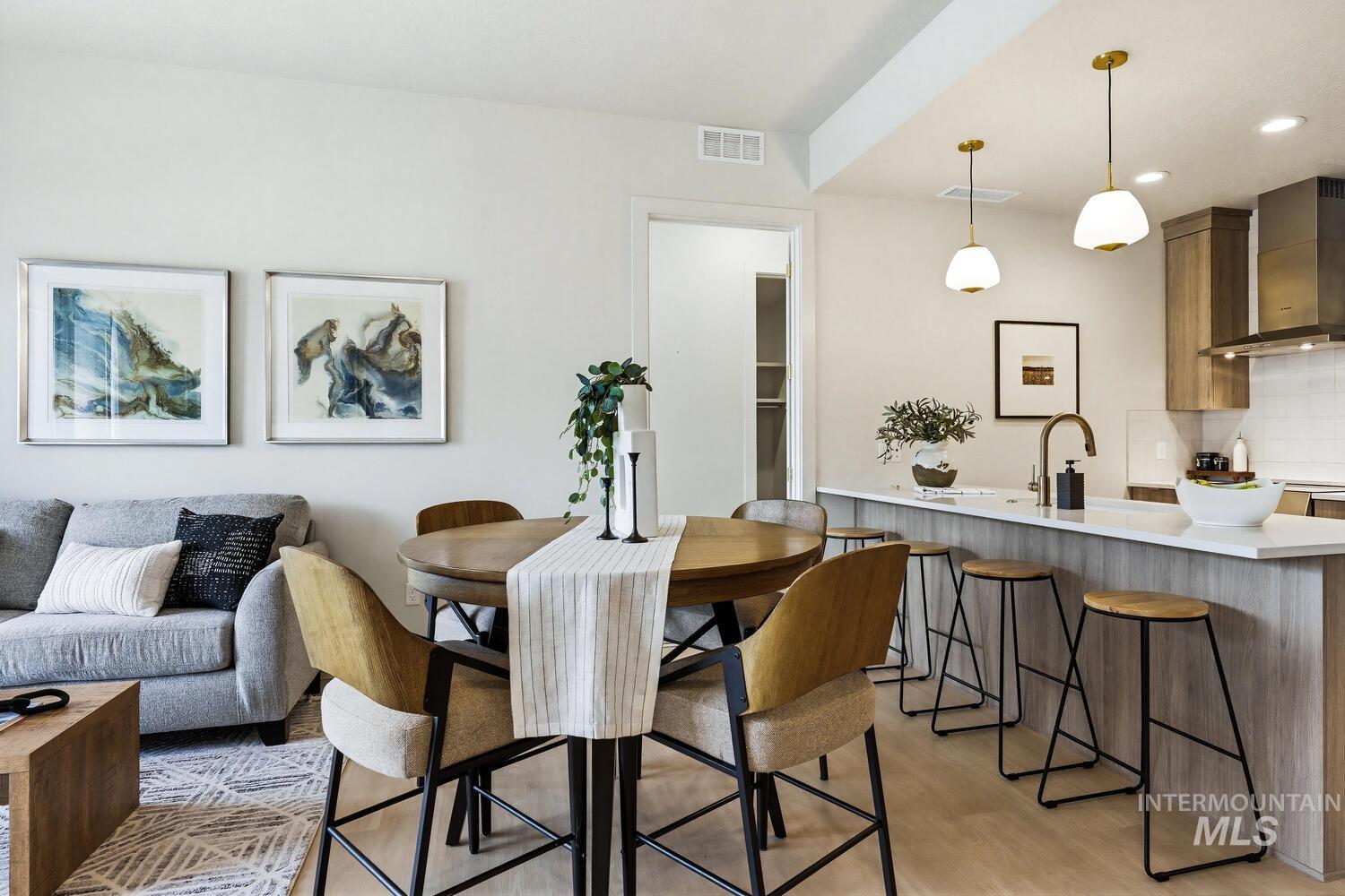 4250 Haystack, Unit 104 Boise, ID 83716 - Photo 10 of 49 Dining area with light wood-style floors and recessed lighting