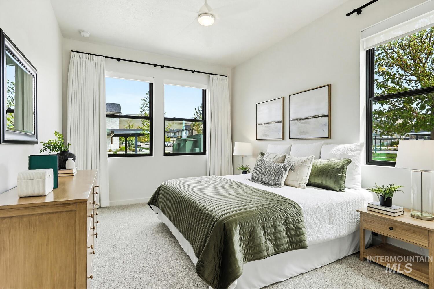 4250 Haystack, Unit 104 Boise, ID 83716 - Photo 16 of 49 Bedroom with light colored carpet and baseboards