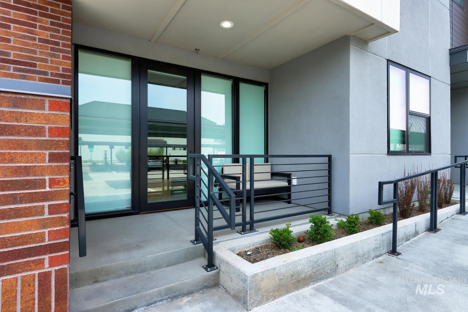 4250 Haystack, Unit 104 Boise, ID 83716 - Photo 2 of 49 Entrance to property featuring stucco siding