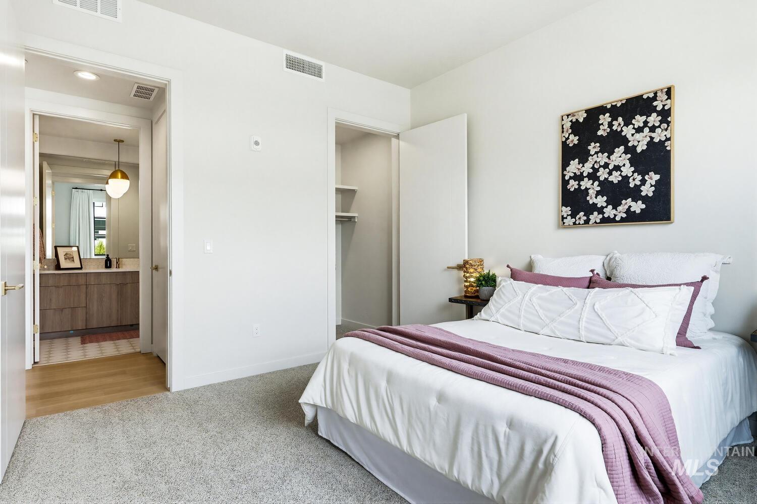 4250 Haystack, Unit 104 Boise, ID 83716 - Photo 22 of 49 Bedroom featuring light colored carpet and a spacious closet