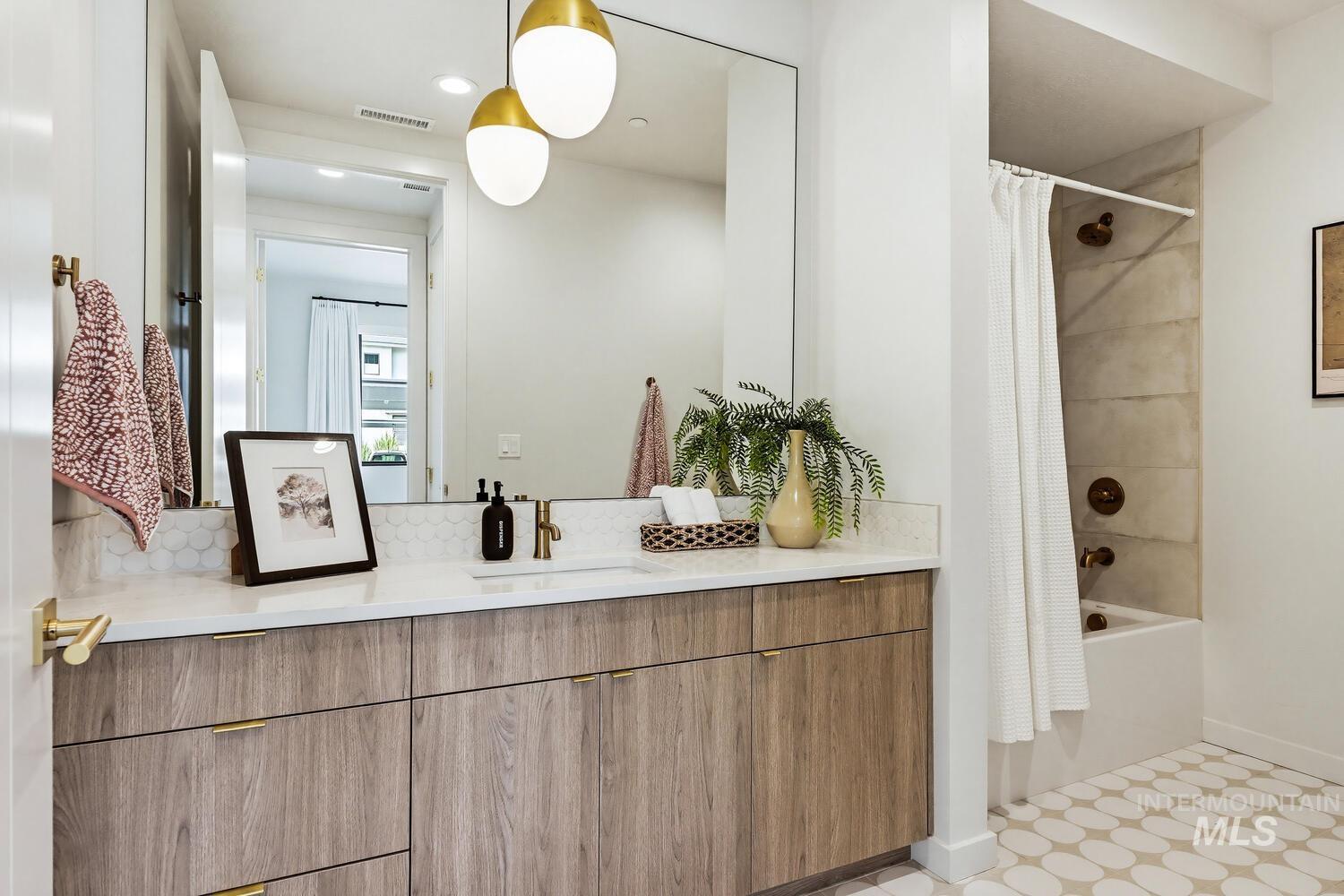 4250 Haystack, Unit 104 Boise, ID 83716 - Photo 25 of 49 Full bathroom featuring vanity, shower / tub combo with curtain, recessed lighting, and light flooring