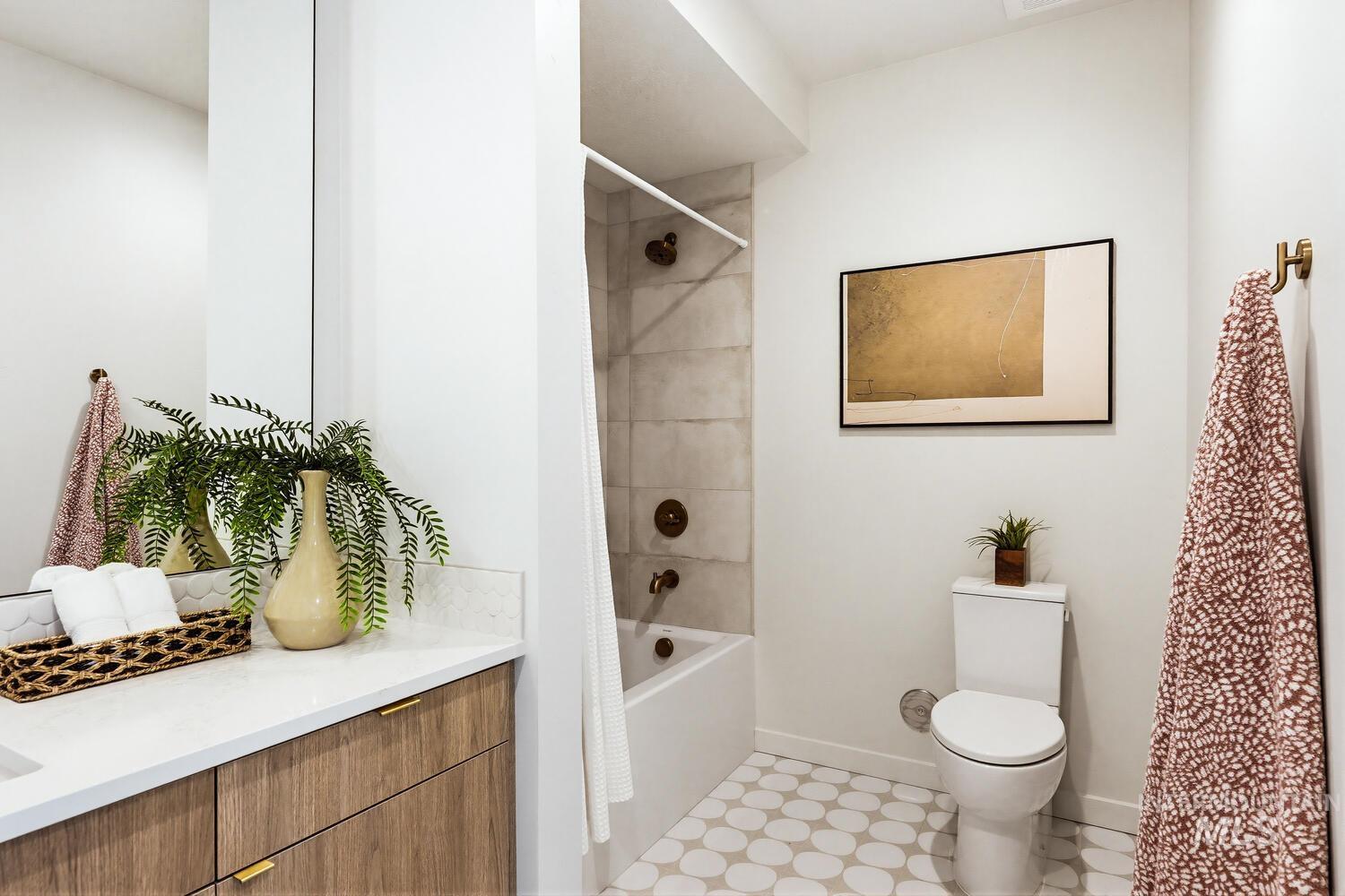 4250 Haystack, Unit 104 Boise, ID 83716 - Photo 26 of 49 Bathroom featuring shower / bathtub combination with curtain and vanity