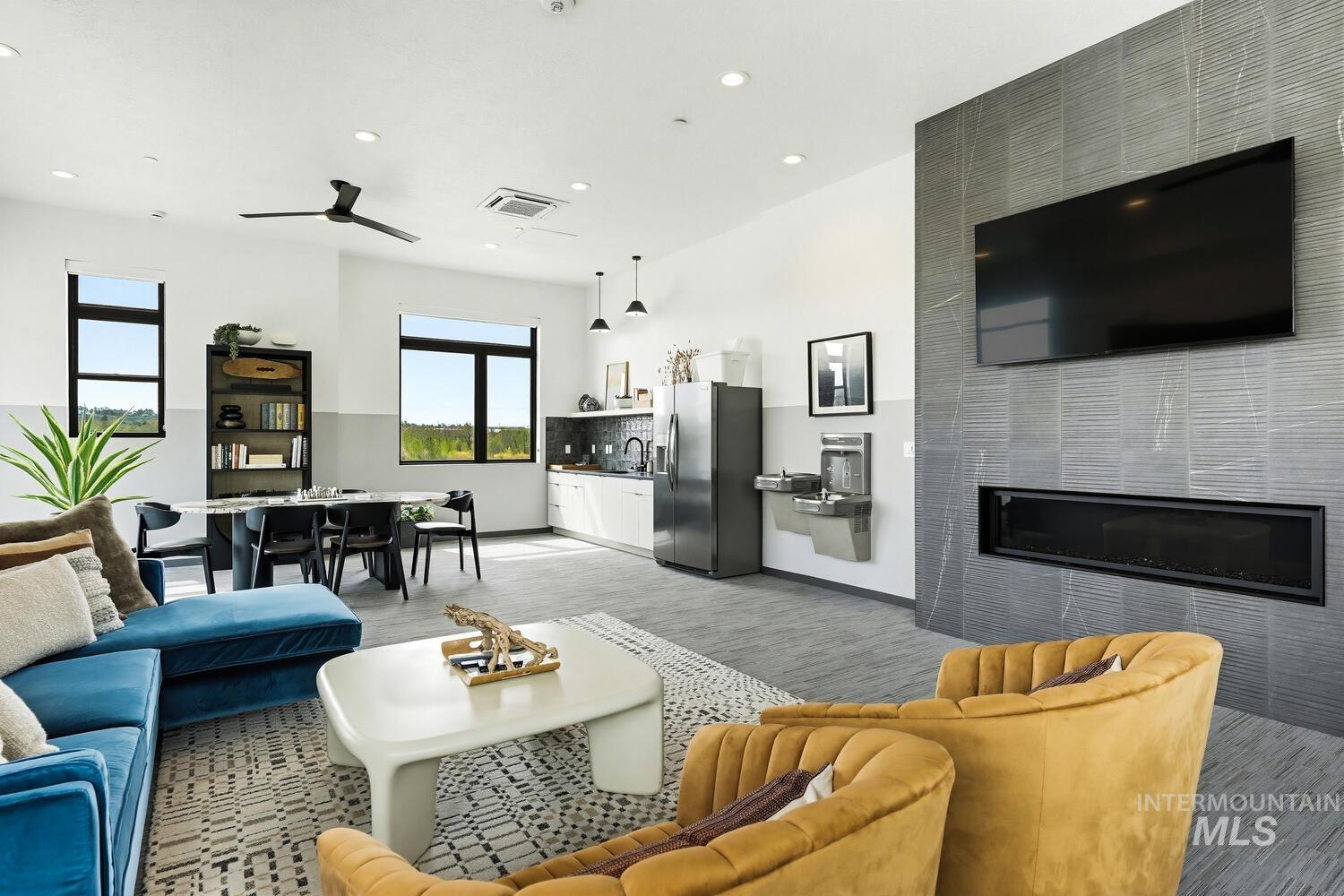 4250 Haystack, Unit 104 Boise, ID 83716 - Photo 34 of 49 Living area with recessed lighting and a tiled fireplace