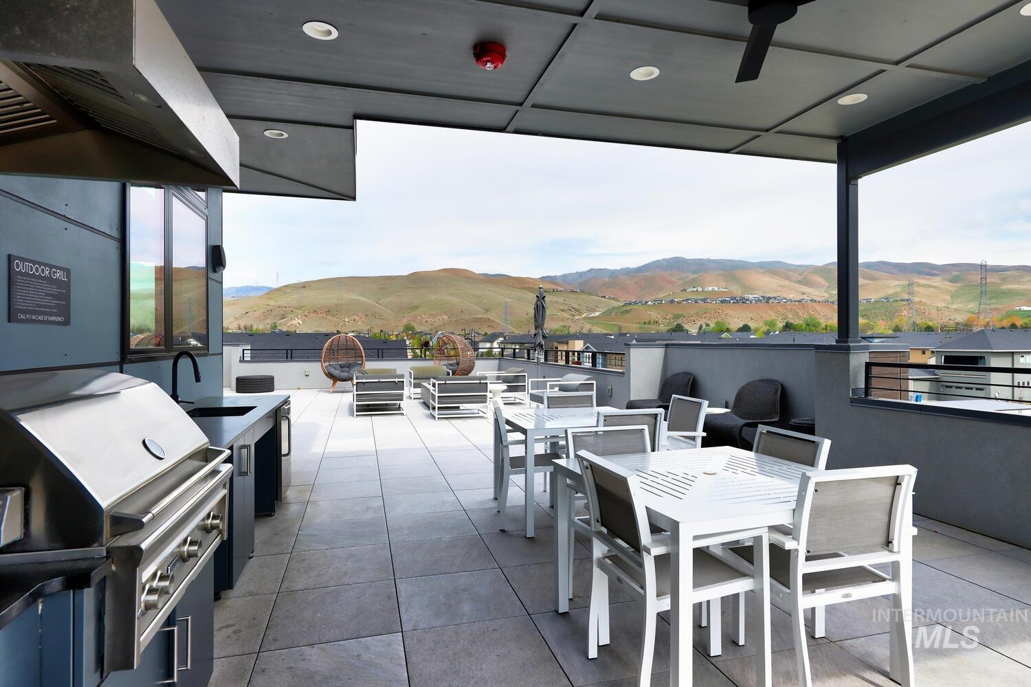 4250 Haystack, Unit 104 Boise, ID 83716 - Photo 39 of 49 View of patio / terrace with an outdoor kitchen / dining area and a mountain view