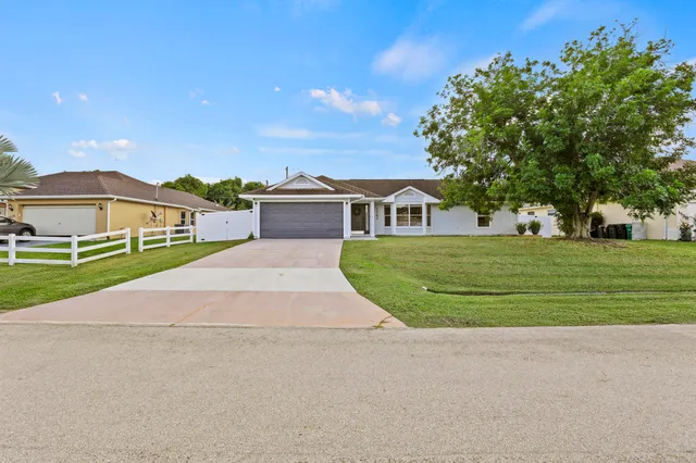 a view of house with outdoor space and street view