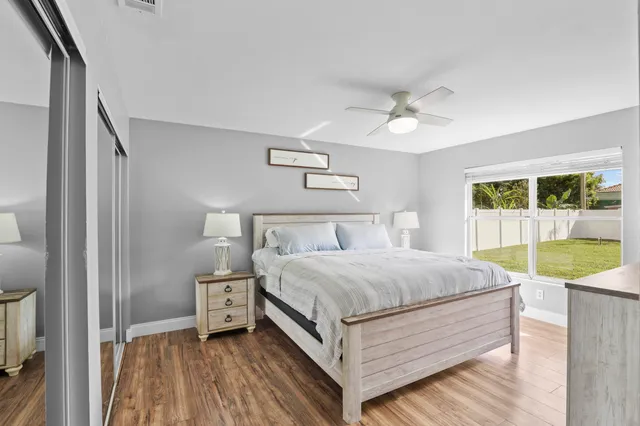 a bed room with a bed and a chandelier