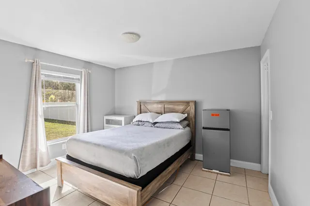 a bedroom with a bed and a table