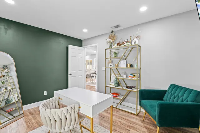 a bedroom with a bed and a couch