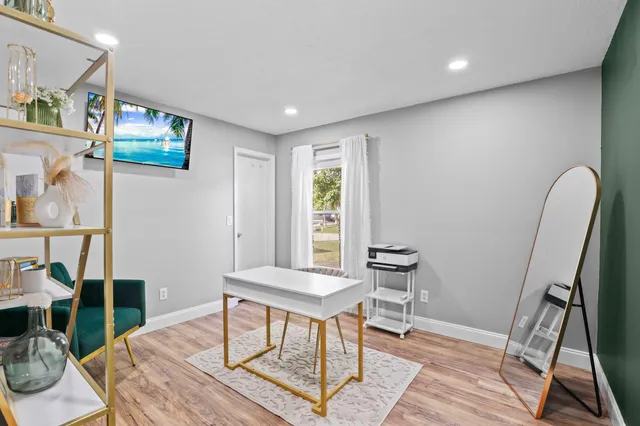 a workspace with furniture and wooden floor