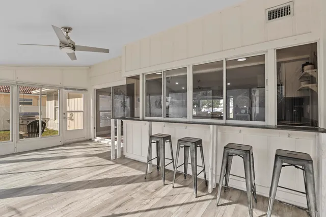 a view of a living room and entryway