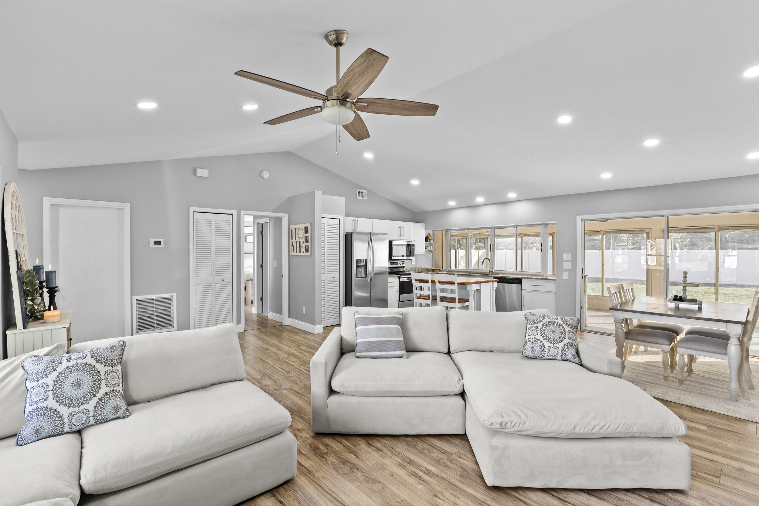 1542 Southwest Dycus Avenue Port St. Lucie, FL 34953 - Photo 10 of 34 a living room with furniture and a large window