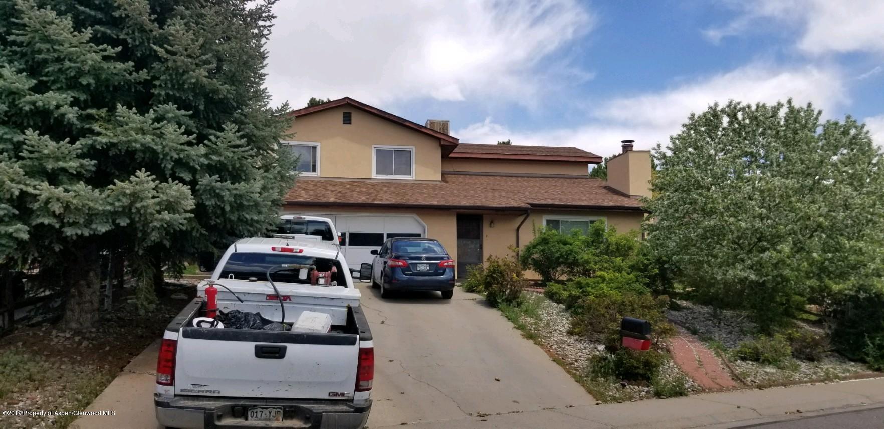1428 Jays Avenue Rifle, CO 81650 - Photo 1 of 14 a car parked in front of house
