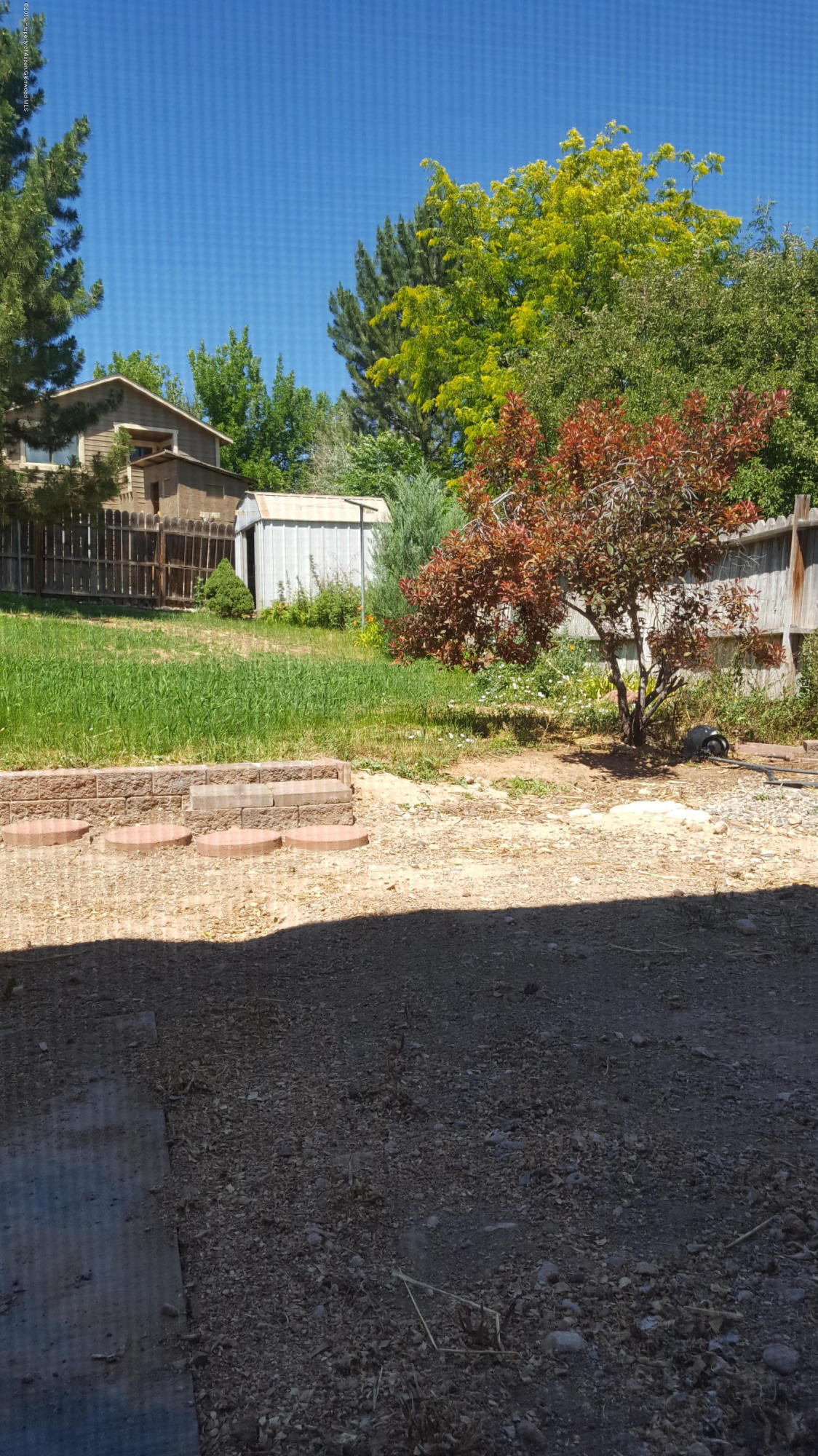 1428 Jays Avenue Rifle, CO 81650 - Photo 14 of 14 a view of a house with a yard and plants