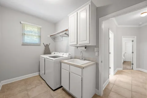 a view of a storage & utility room with two washing machine