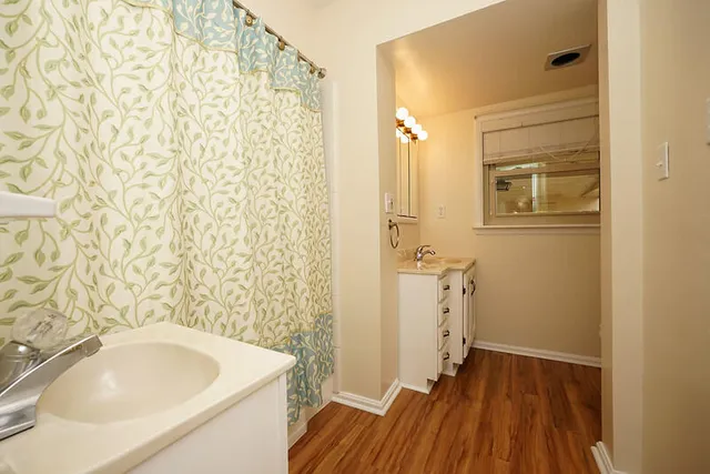 a bathroom with a sink and toilet