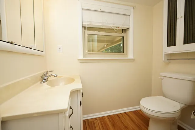 a bathroom with a shower sink and mirror