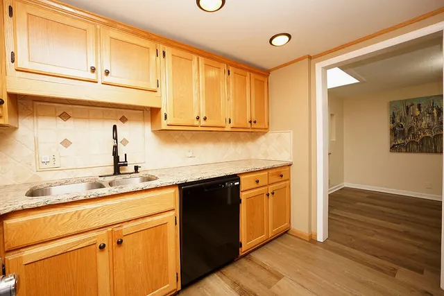 a view of empty room with a fireplace