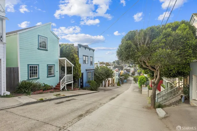 a view of a house with a street