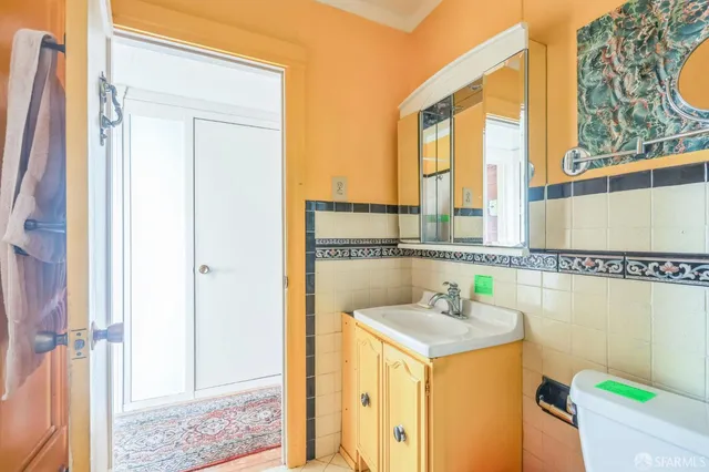 a bathroom with a sink a mirror and a shower