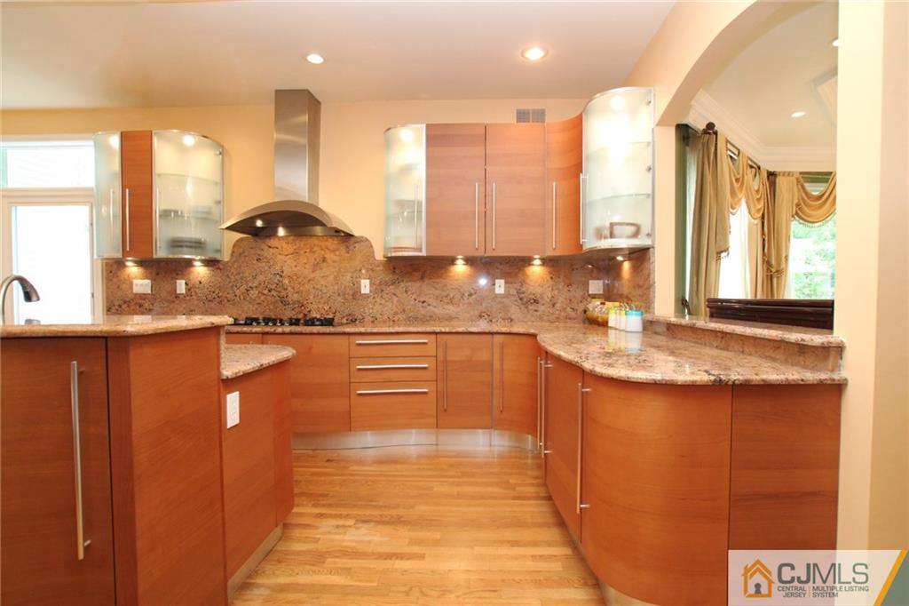 17 Richard Road Edison, NJ 08820 - Photo 11 of 25 a kitchen with stainless steel appliances granite countertop a sink and a large window