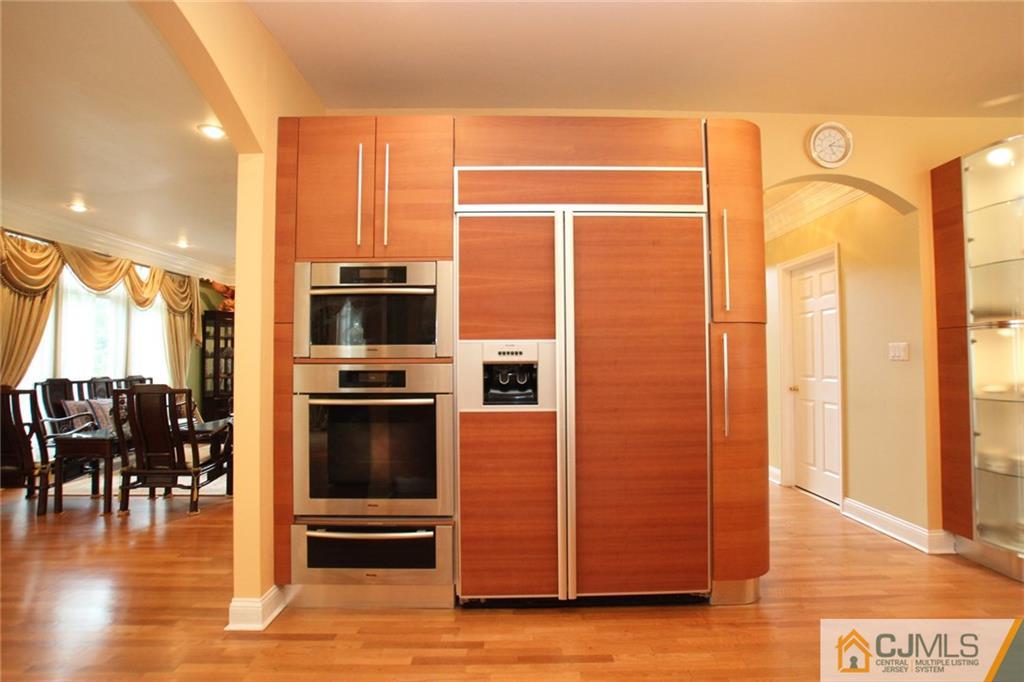 17 Richard Road Edison, NJ 08820 - Photo 12 of 25 a kitchen with stainless steel appliances a refrigerator and a stove top oven