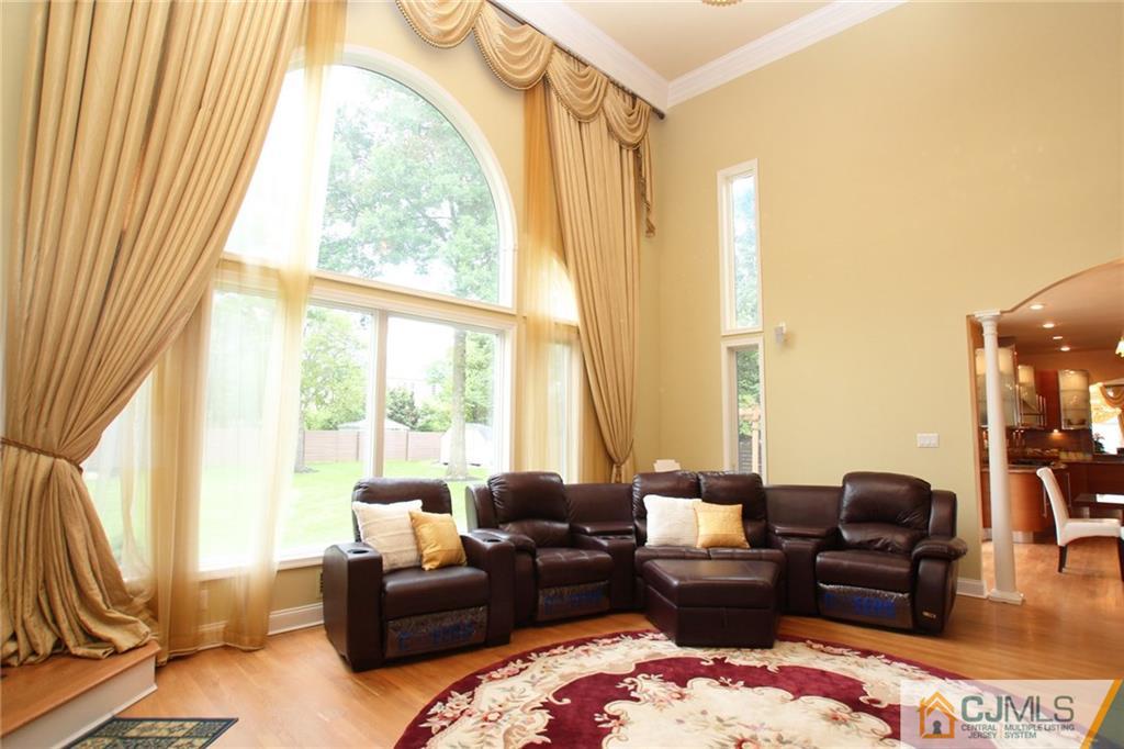 17 Richard Road Edison, NJ 08820 - Photo 15 of 25 a living room with furniture and floor to ceiling windows
