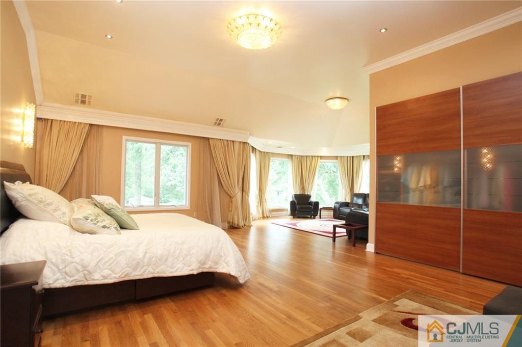 17 Richard Road Edison, NJ 08820 - Photo 16 of 25 a bedroom with a bed and wooden floor