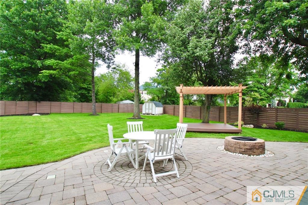 17 Richard Road Edison, NJ 08820 - Photo 3 of 25 a view of a chair and table in backyard of the house