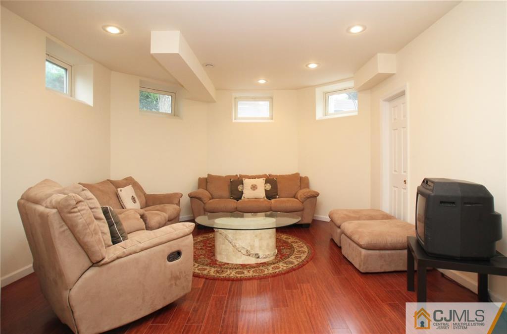 17 Richard Road Edison, NJ 08820 - Photo 22 of 25 a living room with furniture and wooden floor