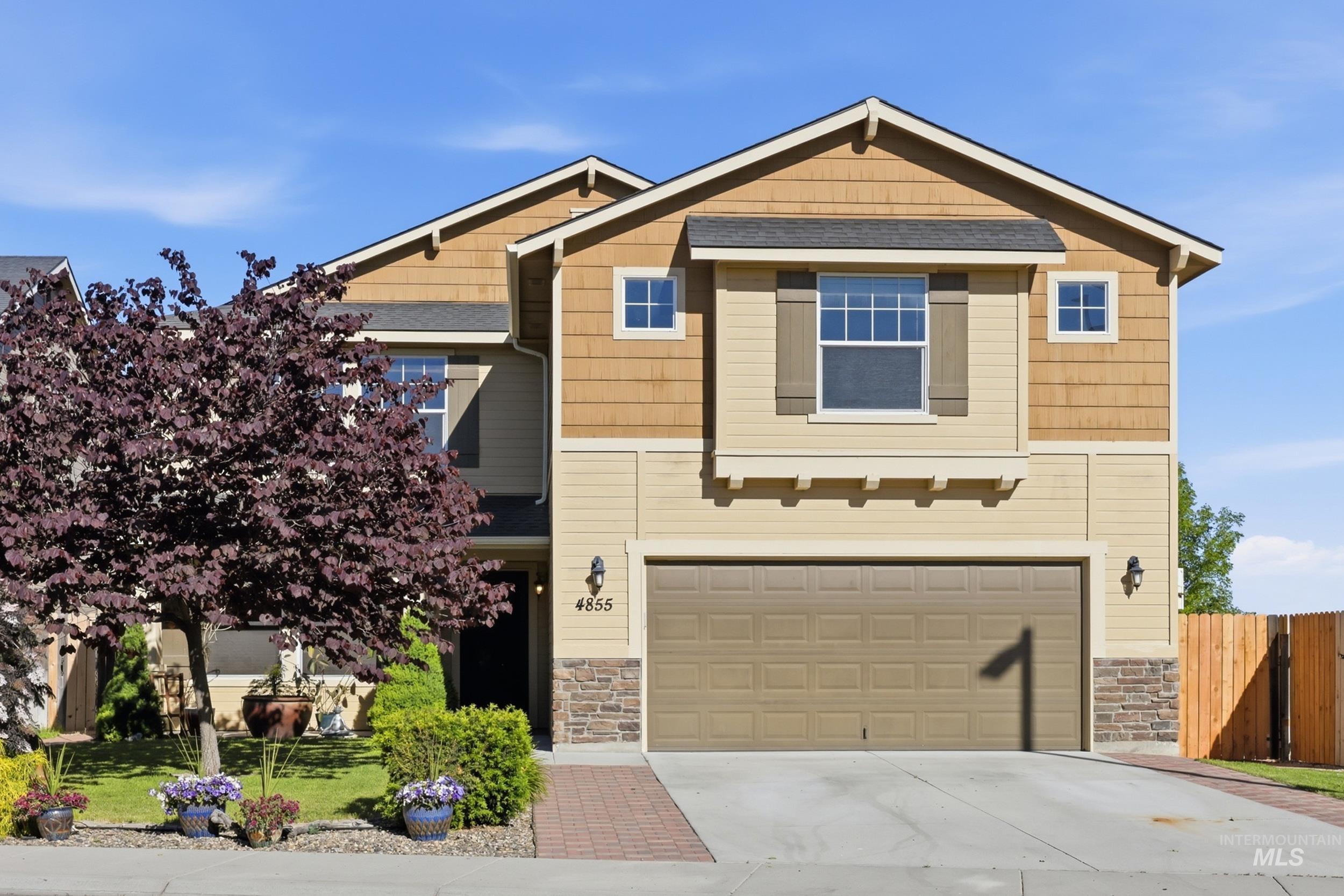 4855 South Chex Way Boise, ID 83709 - Photo 2 of 47 Two-story residence featuring a two-car garage, stone accent siding, and horizontal siding