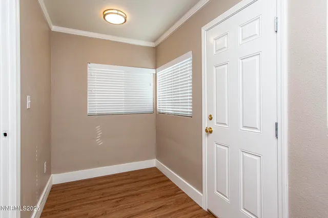 a view of a livingroom with wooden floor