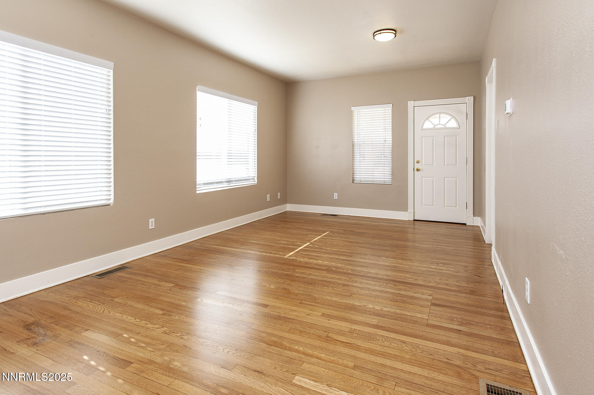 376 Wheeler Avenue Reno, NV 89502 - Photo 18 of 33 a view of an empty room with wooden floor and a window