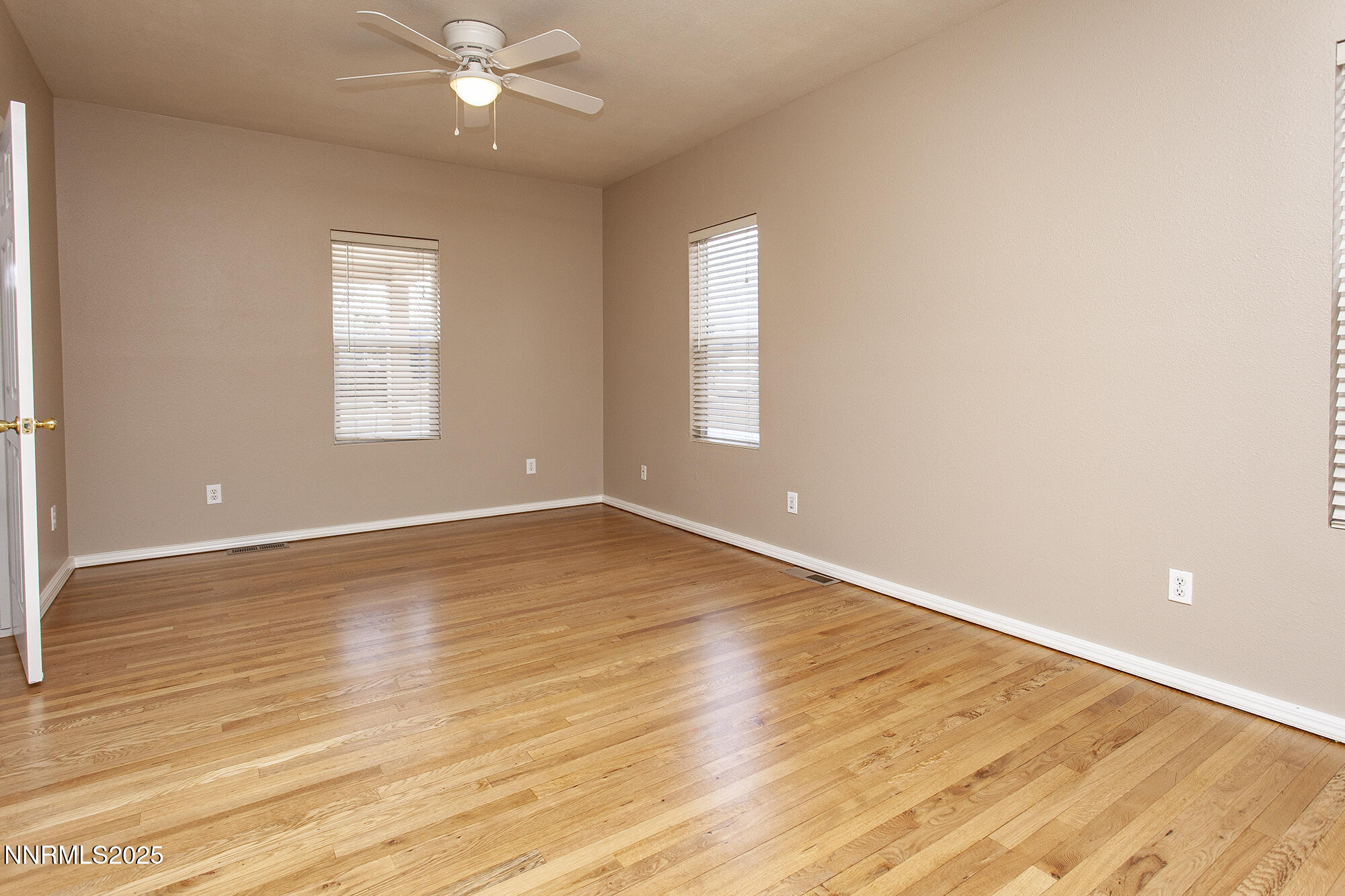 376 Wheeler Avenue Reno, NV 89502 - Photo 26 of 33 an empty room with wooden floor and windows