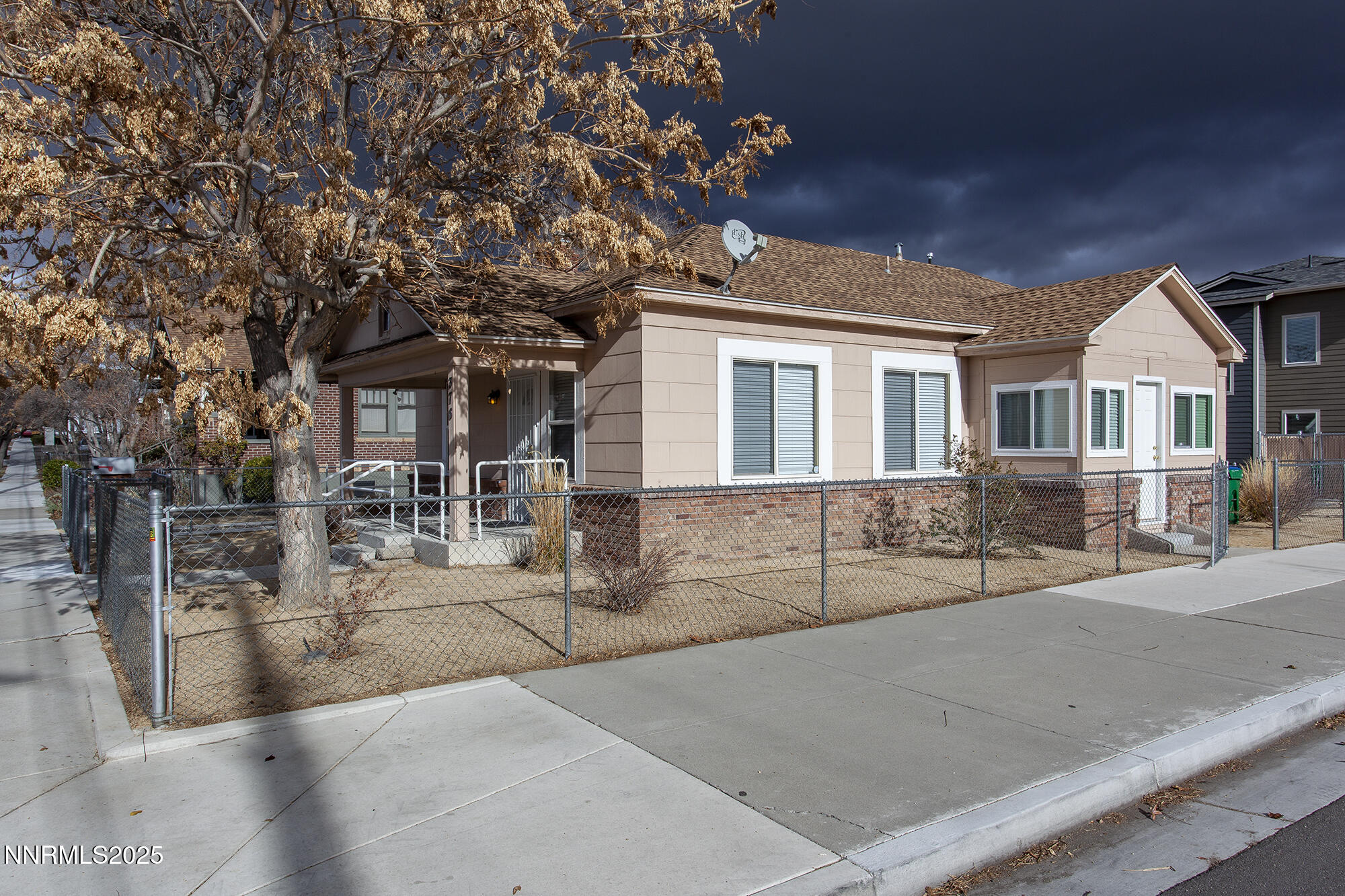 376 Wheeler Avenue Reno, NV 89502 - Photo 3 of 33 front view of a house with a tree