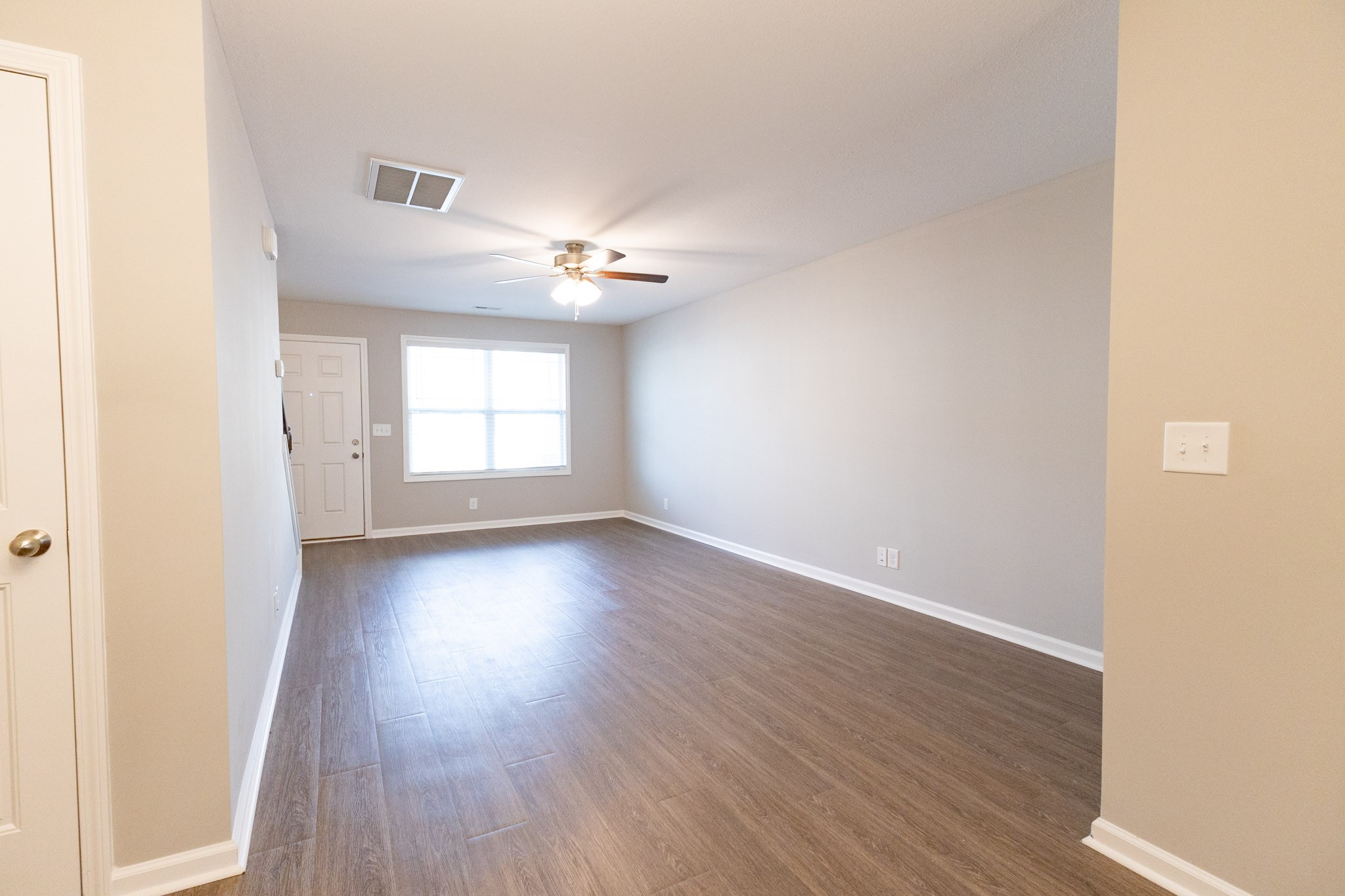 118 Davis Ridge Lane Clarksville, TN 37040 - Photo 14 of 35 an empty room with wooden floor and windows