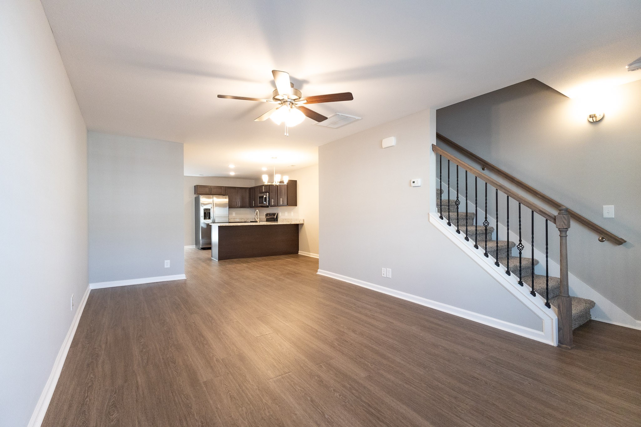 118 Davis Ridge Lane Clarksville, TN 37040 - Photo 6 of 35 a view of an empty room with wooden floor and a ceiling fan