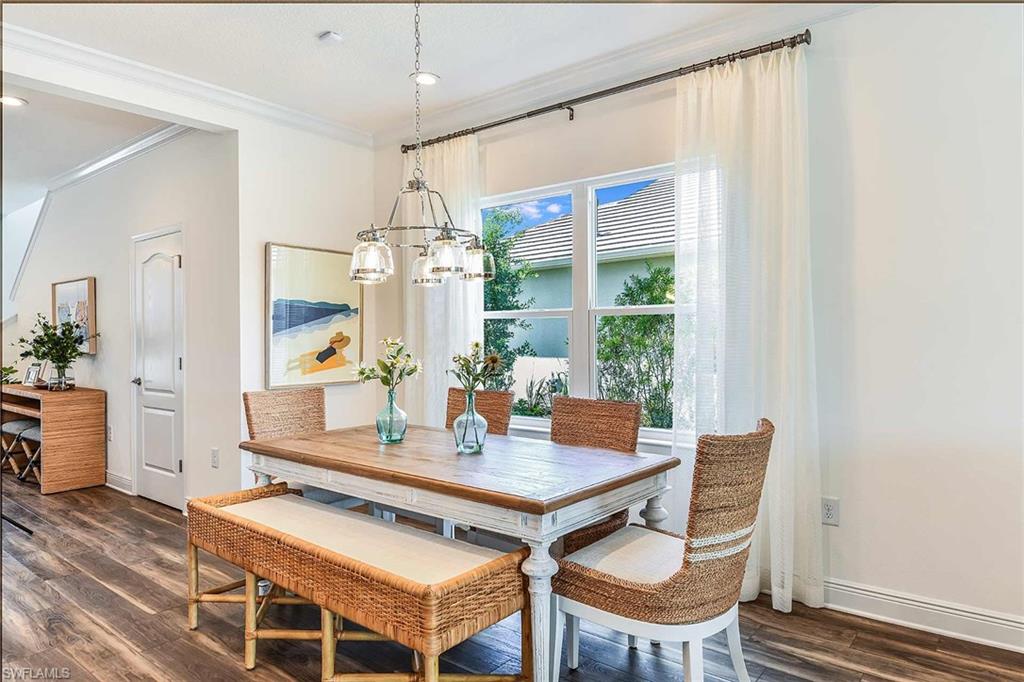 4551 Centaurus Circle Naples, FL 34120 - Photo 11 of 26 a view of a dining room with furniture window and wooden floor