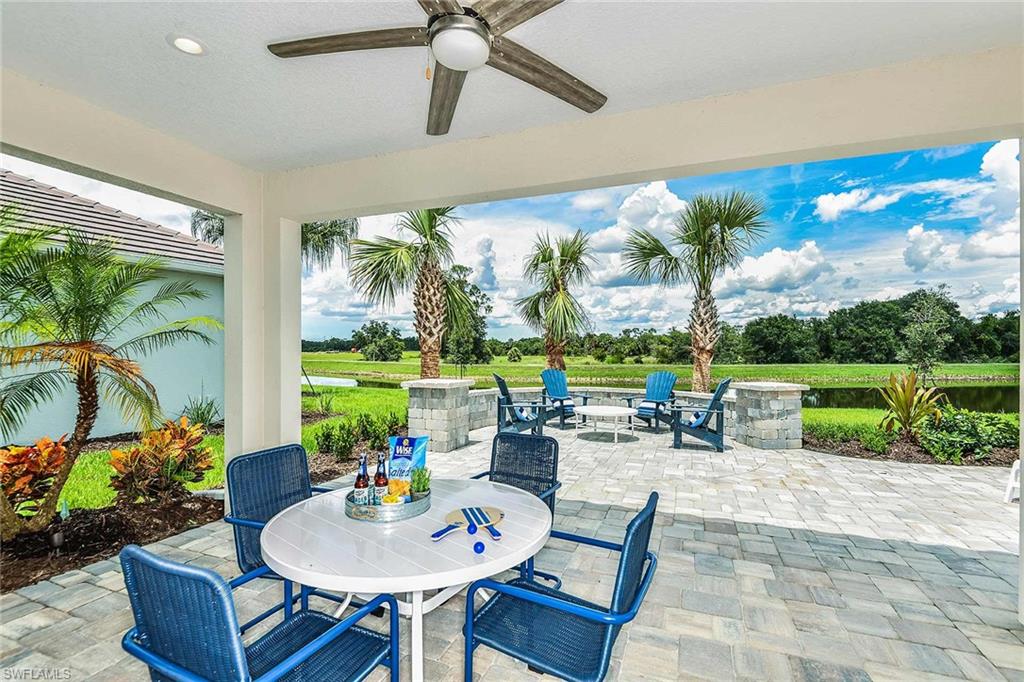 4551 Centaurus Circle Naples, FL 34120 - Photo 18 of 26 a outdoor space with furniture and garden view