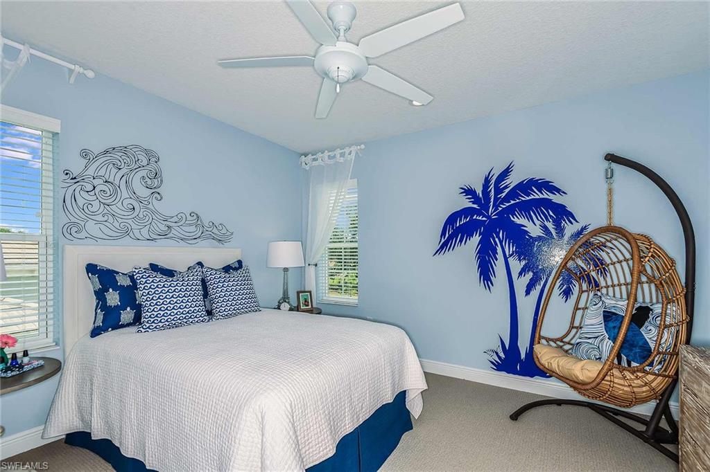 4551 Centaurus Circle Naples, FL 34120 - Photo 23 of 26 a bedroom with bed and ceiling fan