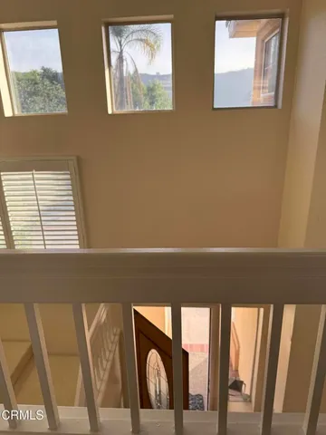 a view of a hallway with a white walls