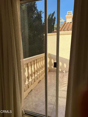 a bathroom with a granite countertop sink a mirror and a bathtub