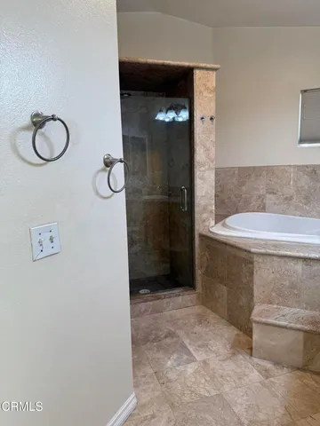 a white toilet sitting next to a shower