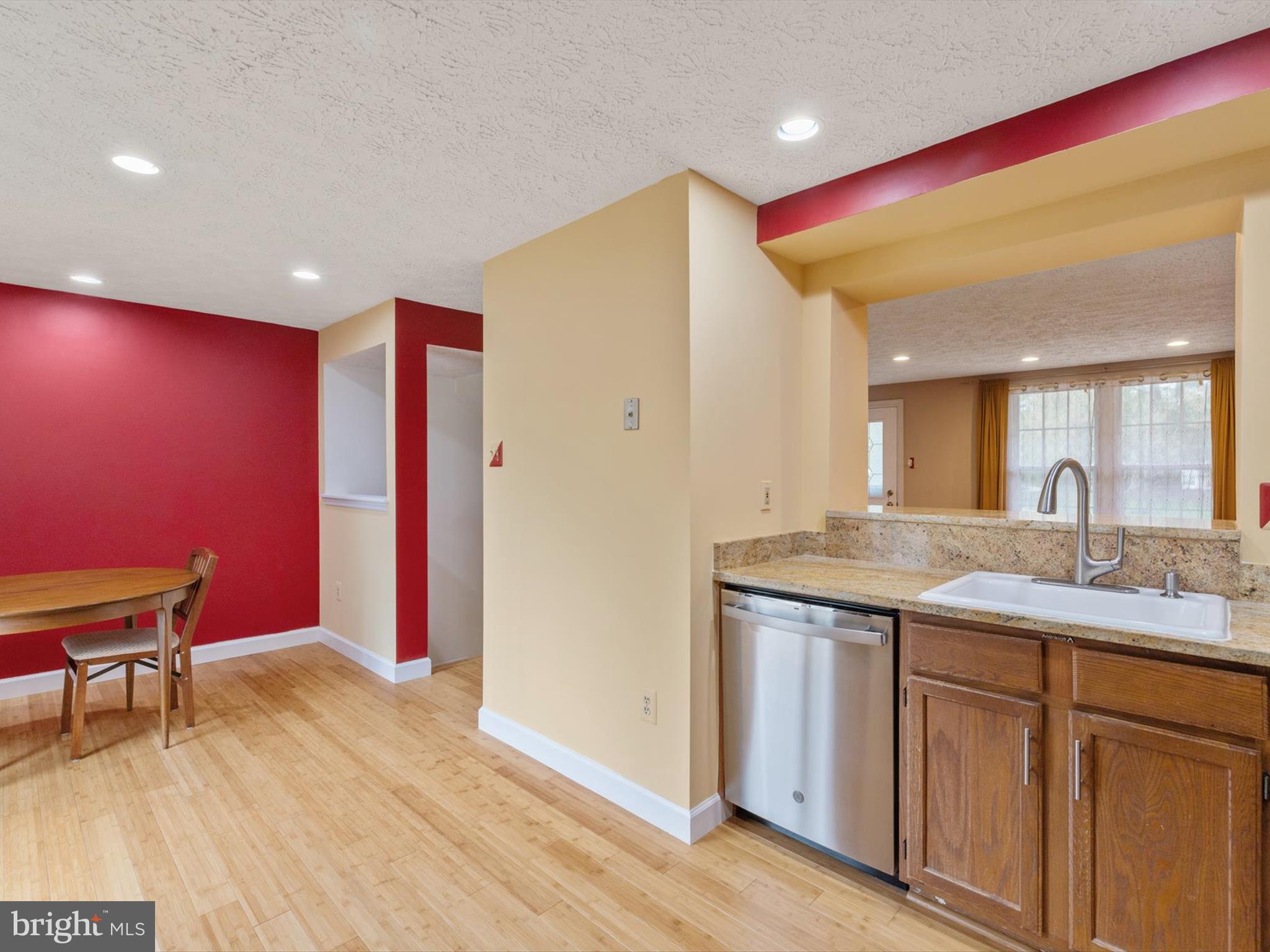 653 Willowby Run Pasadena, MD 21122 - Photo 12 of 31 a spacious bathroom with a granite countertop sink and a mirror